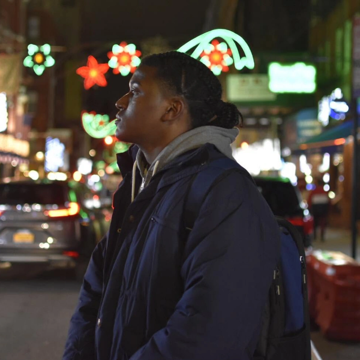 Keogea photographed at night on a neon-lit city street